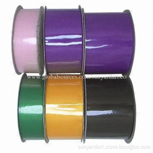 Sheer organza ribbon spool, available in hundreds stocked colors